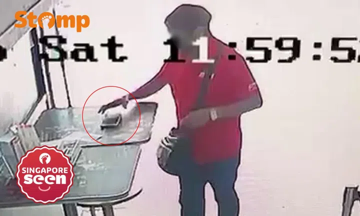 Man takes phone left behind at Singapore Pools outlet