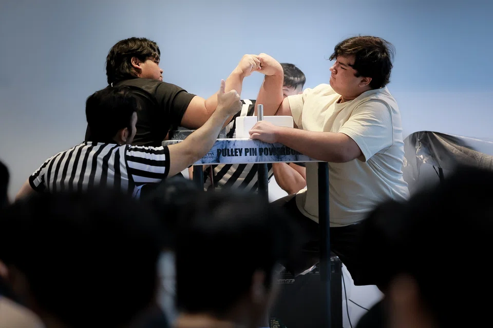 Muhammad Adzhan (left) and Raheel Mughal competing at the Singapore Armwrestling Open Brawl on Jan 18.