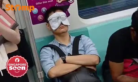 Handkerchief as eye mask on MRT train
