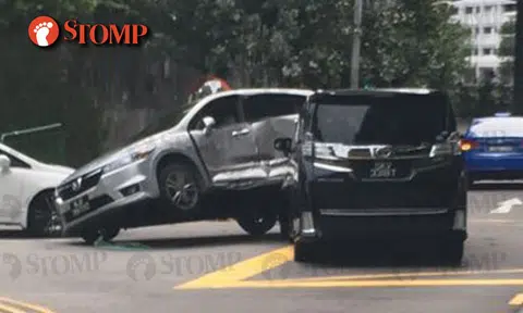 Toyota wrecked and left tilted to one side in accident along Telok Blangah Road