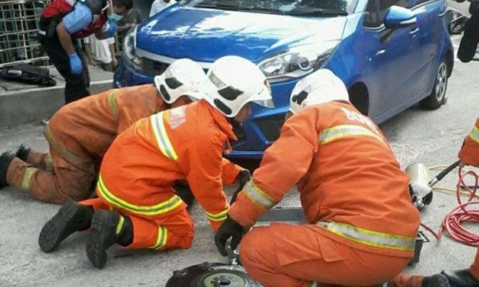 Woman run over by own car in Malaysia after she tried to stop it from ...