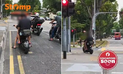 Two men ride e-bike without helmets, allegedly overtake cyclist along Tiong Bahru Road