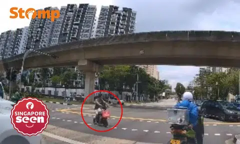 Man riding PMD with boy crosses against red light, Stomper says this is why youths ignore rules