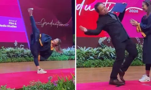 poly graduate executes side kick during graduation ceremony