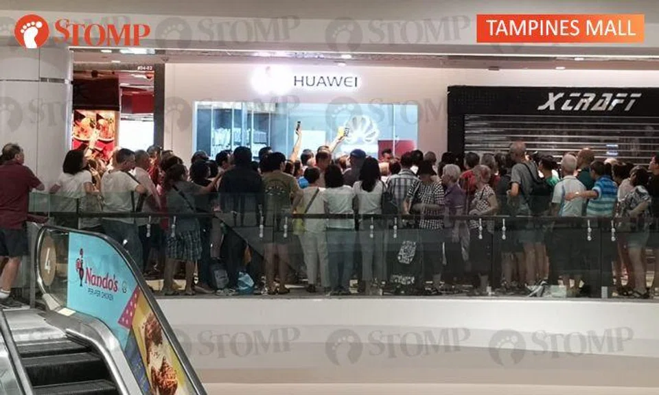 Crowds rowdy after queueing for $54 Huawei phone, several outlets closed for 'security reasons'