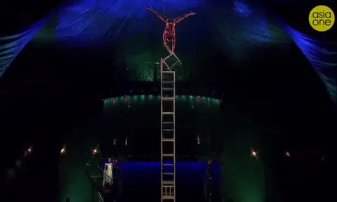 Balancing on 7m tower of chairs no sweat for daredevil Cirque du Soleil artiste