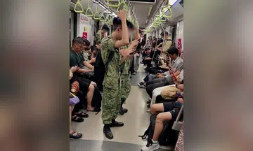 A Threads user shared an image of NSFs using their mobile phones while commuting on the MRT.