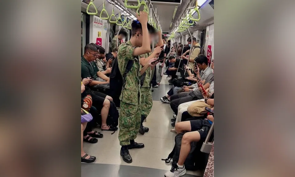 A Threads user shared an image of NSFs using their mobile phones while commuting on the MRT.