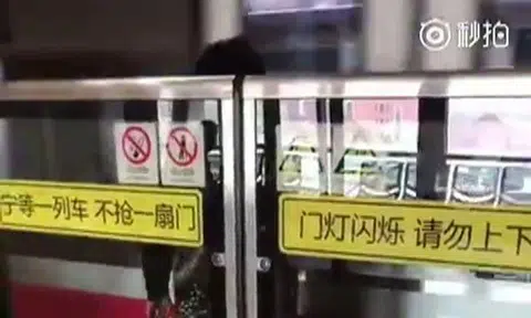 Shanghai woman escapes unscathed after being sandwiched in between train and platform doors