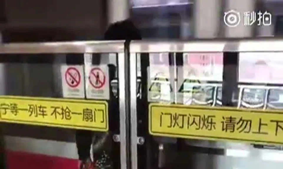 Shanghai woman escapes unscathed after being sandwiched in between train and platform doors