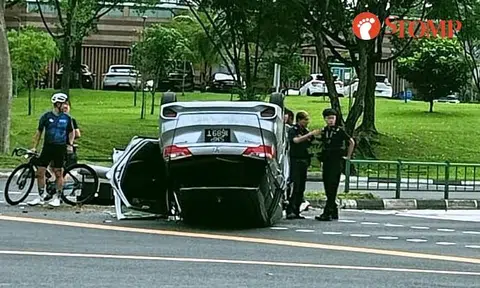 Overturned Honda at Serangoon junction believed to have skidded, knocked down traffic light pole