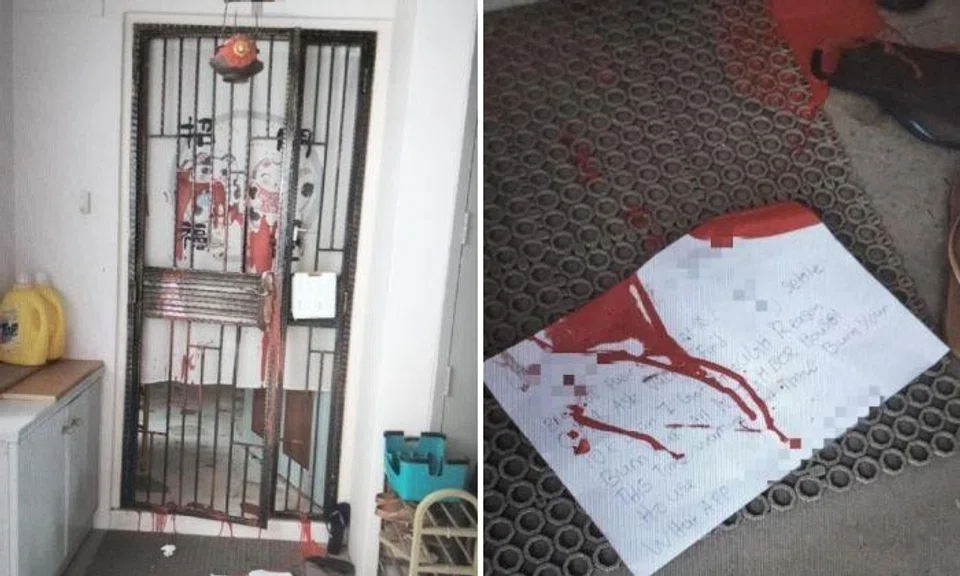 The doors of two Pasir Ris flats were splashed with red paint and debtor’s notes were left at the gates.