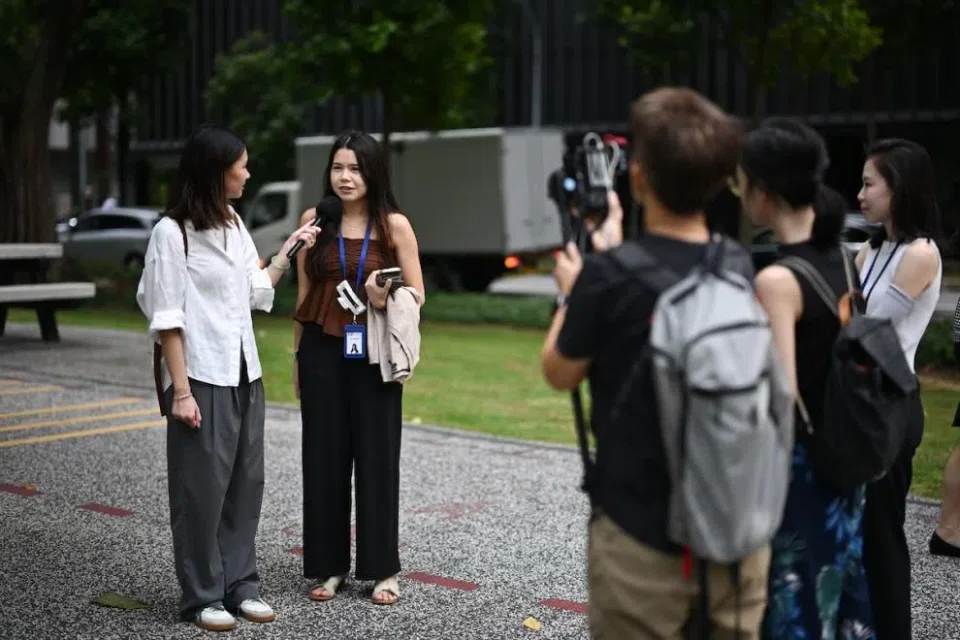 The writer interviewing Ms Jane Fernandez, 23, a market analyst, near Tanjong Pagar MRT station on Dec 17, 2024