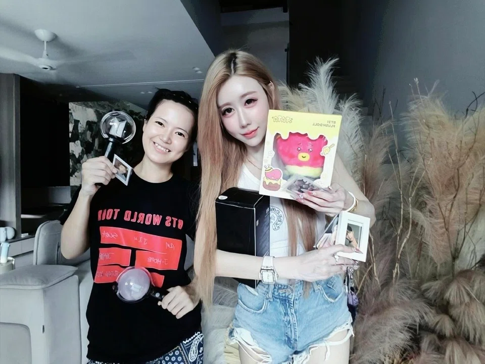 Domestic helper and BTS fan Nant Lah Sann Hie (left) received a VIP concert ticket from her employer Yvonne Lee.