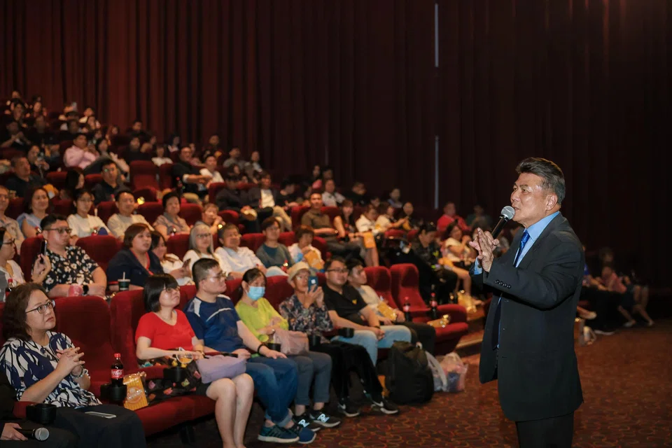 Singaporean director Jack Neo addressing the crowd during the event at Golden Village VivoCity. ST PHOTO: GAVIN FOO