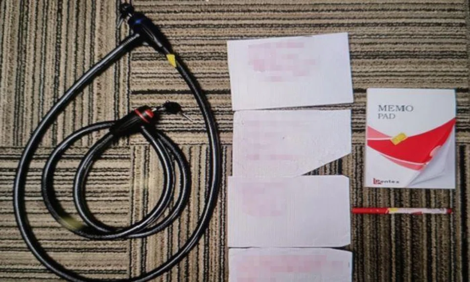 2 arrested for loanshark harassment after woman seen trying to lock gate of Tampines unit