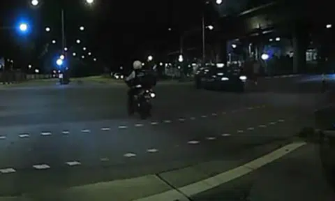 Wait, is that a traffic enforcement officer running the red light?