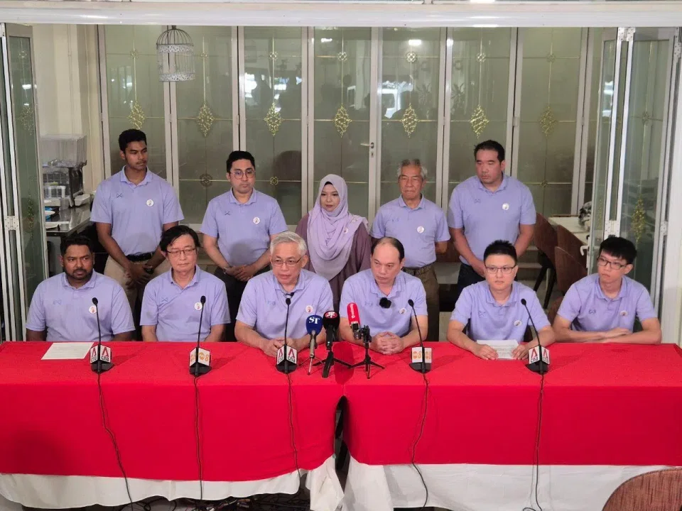 People's Power Party secretary-general Goh Meng Seng (front row, third from left) and his team members speaking at a press conference on April 22. 