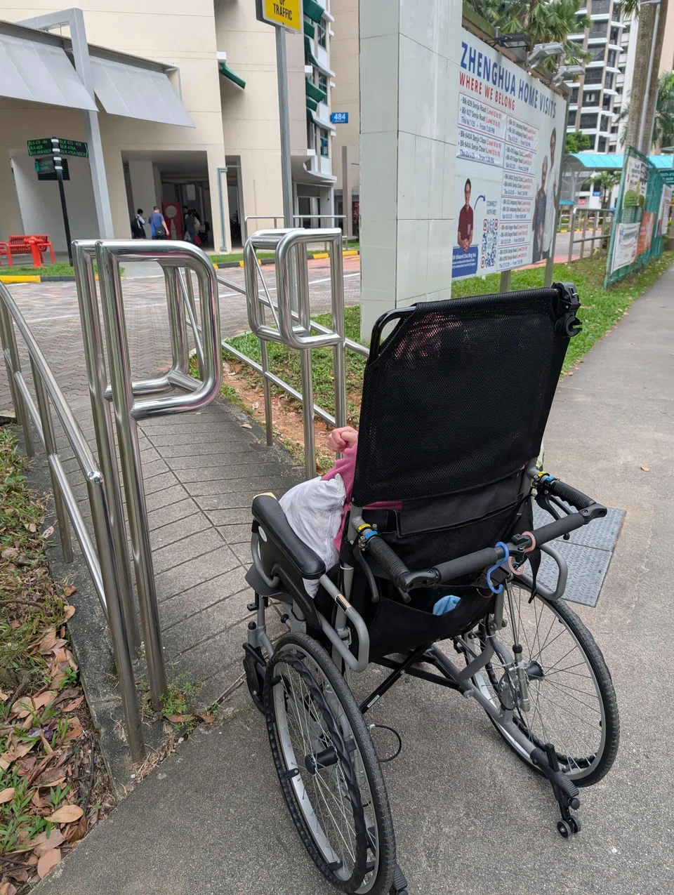 Why is there a railing on a ramp that inconveniences disabled people?