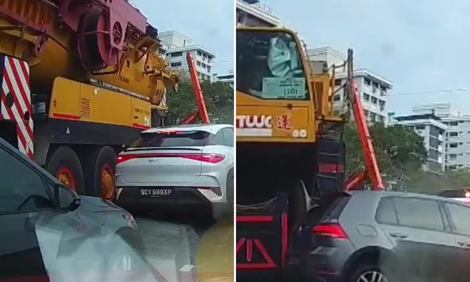 Mobile crane's rear swings into adjacent car while turning at Pasir Ris junction