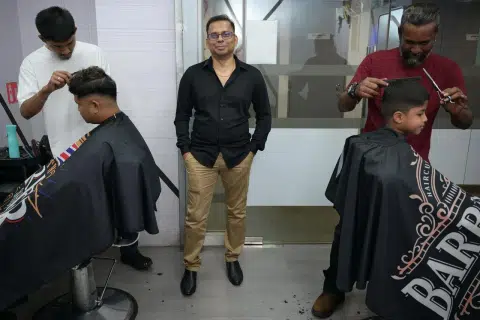Barber shop boss gives free haircuts to seniors and the disabled
