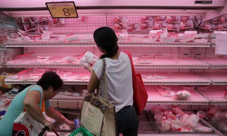 Shoppers will be able to buy up to only six cans of canned products, five litres of cooking oil and $30 of frozen poultry when there were previously no limits. ST PHOTO: GIN TAY