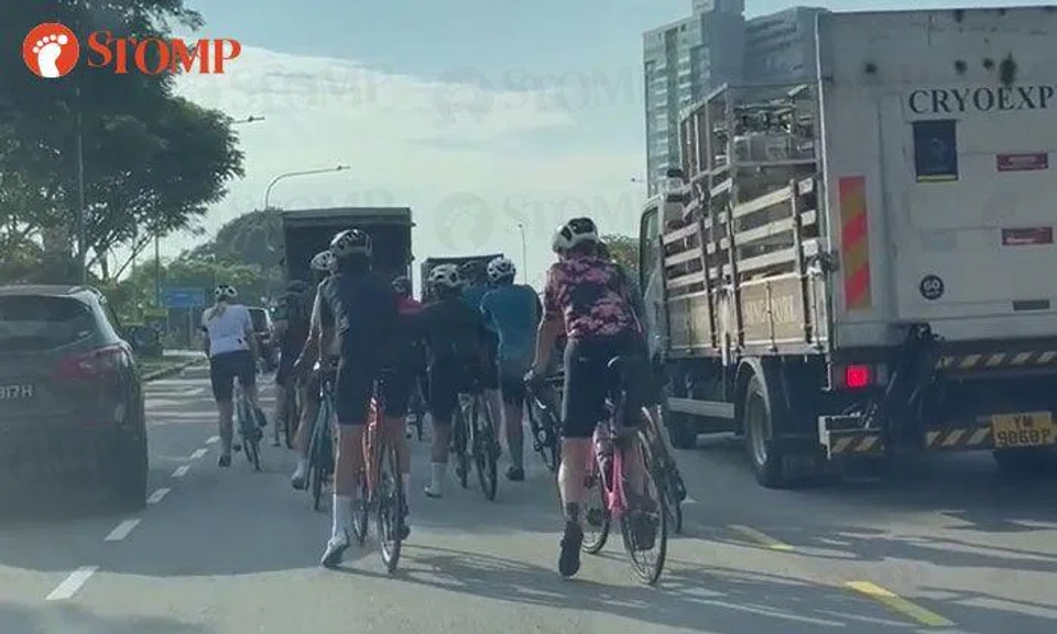 Vehicles slow down to pass large group of cyclists at Jalan Anak Bukit Flyover: 'Fine them all'