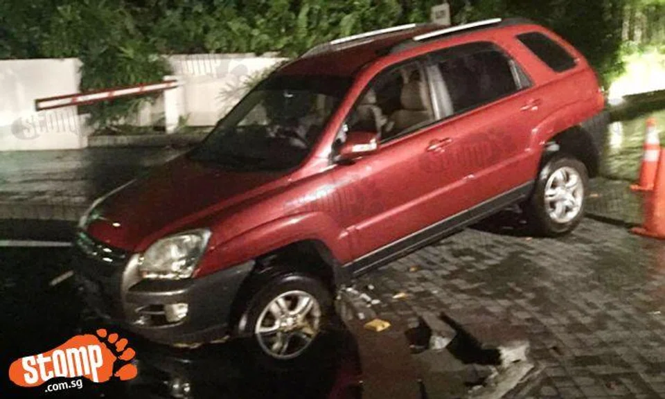 A few centimetres more and female driver would have dived into fountain at Oxley Road condo