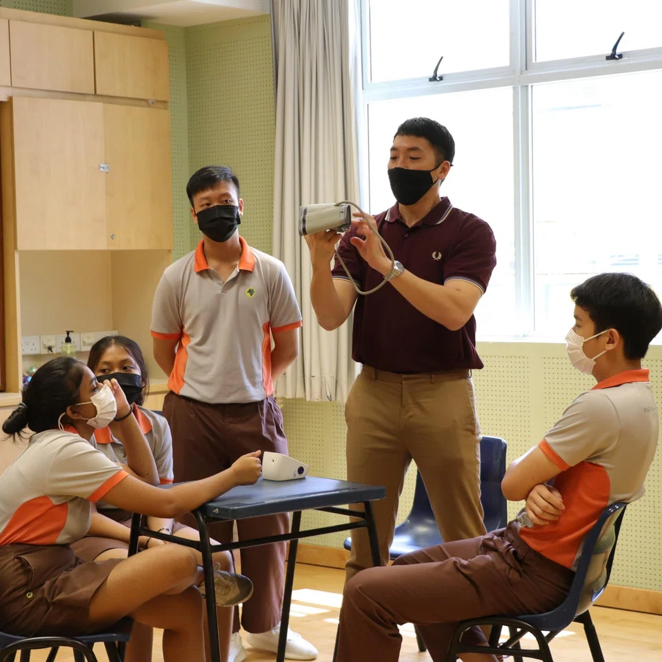 Mr Darryl Lee (third from left) attending a health and nursing module at Bukit View Secondary in 2021 during the school's Applied Learning Week.