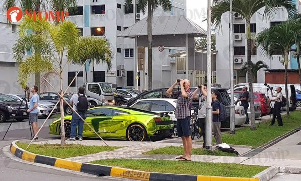 Nice Lambo over there, but these folks at Yishun St 11 have their eyes glued to something else
