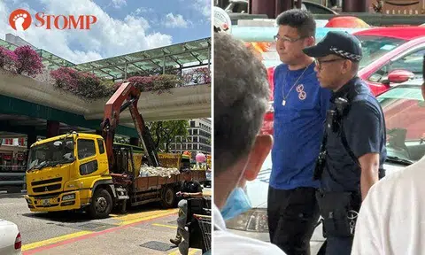 Lorry driver, 46, arrested after crane hits overhead bridge in Chinatown