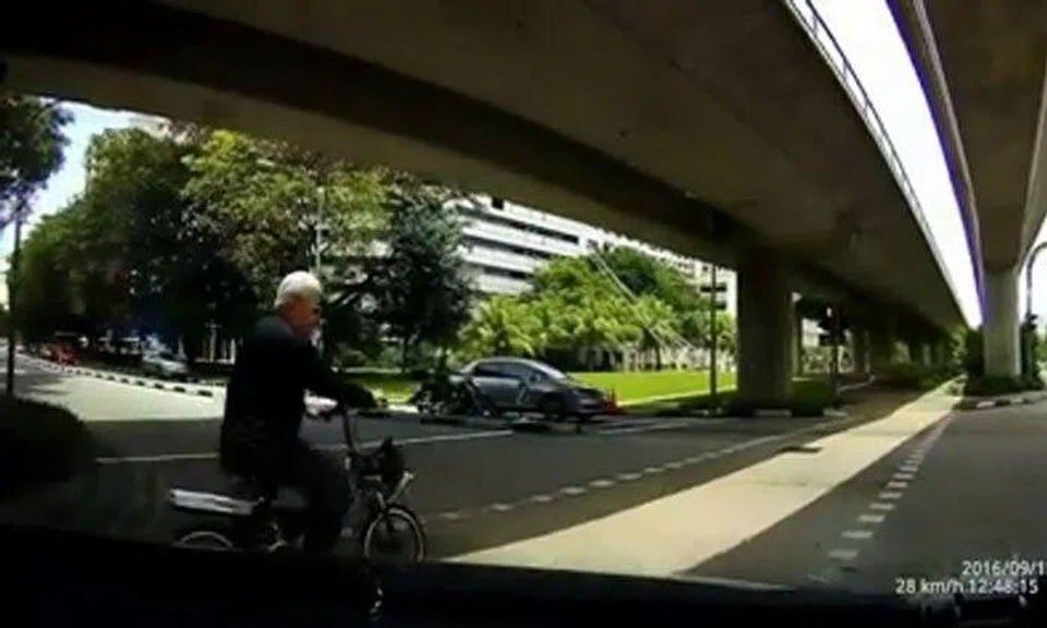 Look how close cyclist comes to being run over after beating red light