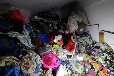 Elderly man sleeps outdoors as Bedok flat overflows with junk