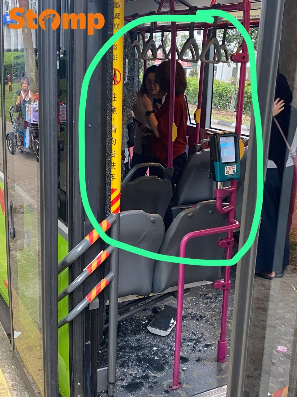 Glass panel shatters on bus.
