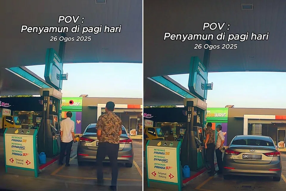 A Malaysian man could be seen pointing towards a notice at the pump.