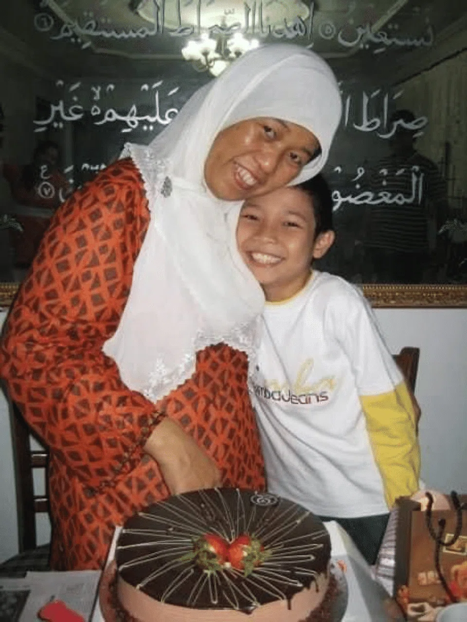 Ahmad Ashrafiqri Kahar Muzakar and his foster mum