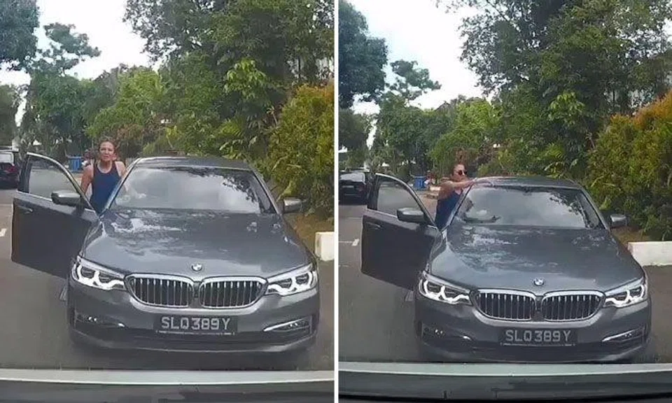 Female BMW driver goes against traffic then asks approaching motorist to give way to her