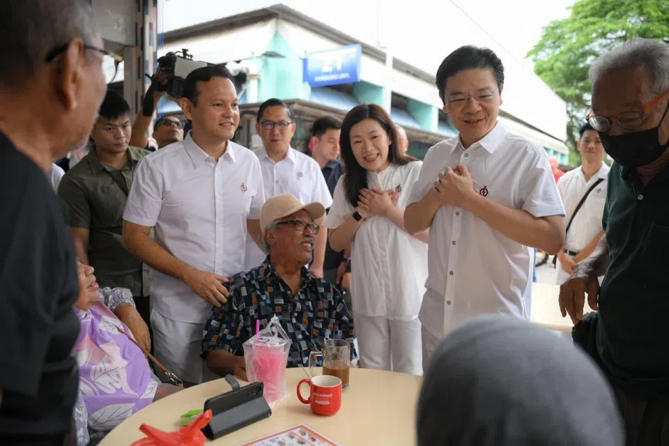 (From right) PM Lawrence Wong and his Marsiling-Yew Tee GRC teammates Hany Soh, Alex Yam and Zaqy Mohamad greeting residents at Marsiling Market on May 4.