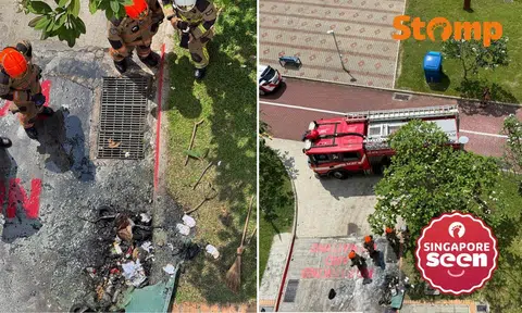 The fire involved the discarded items in a bin on the ground floor, said the SCDF.