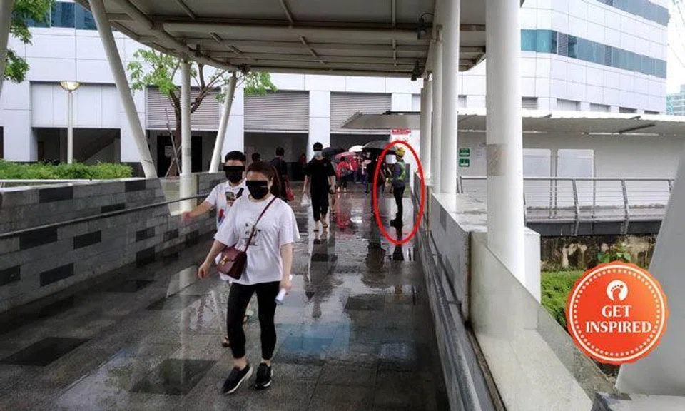 Netizen praises workers for handing out umbrellas outside ICA Building during rain