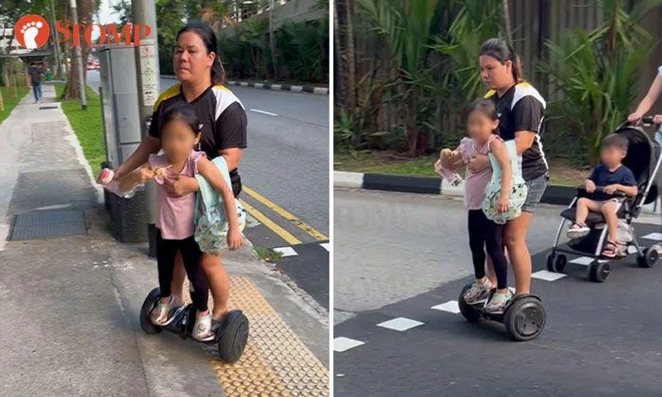 Is this safe? Woman rides hoverboard with young girl at Newton pedestrian crossing
