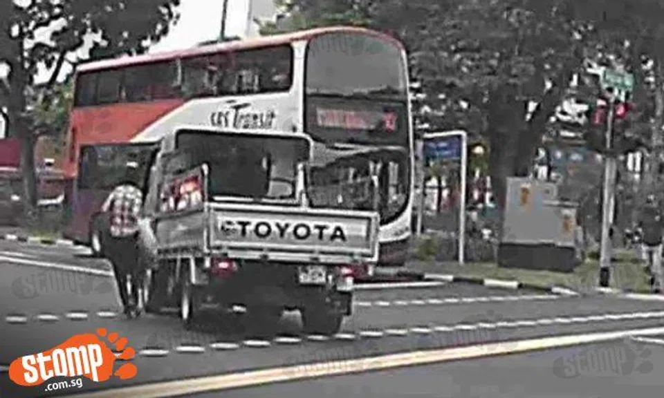 Watch out! Look how close woman came to being knocked down by pick-up truck at Siglap Road