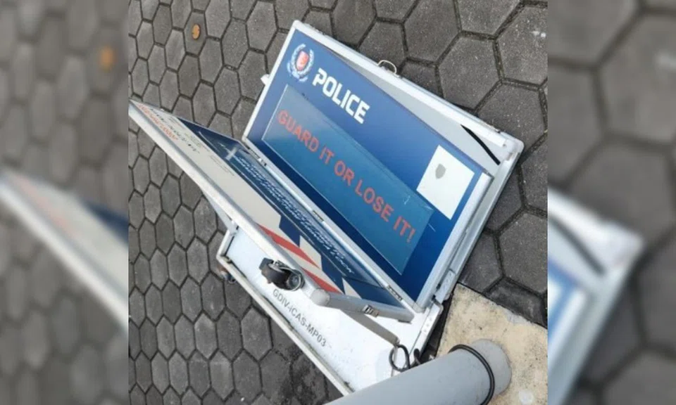 vandalising police sign