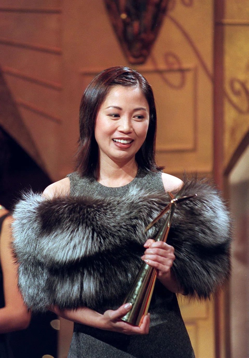Xiang Yun winning Best Supporting Actress in 1998 for the drama Around People's Park.