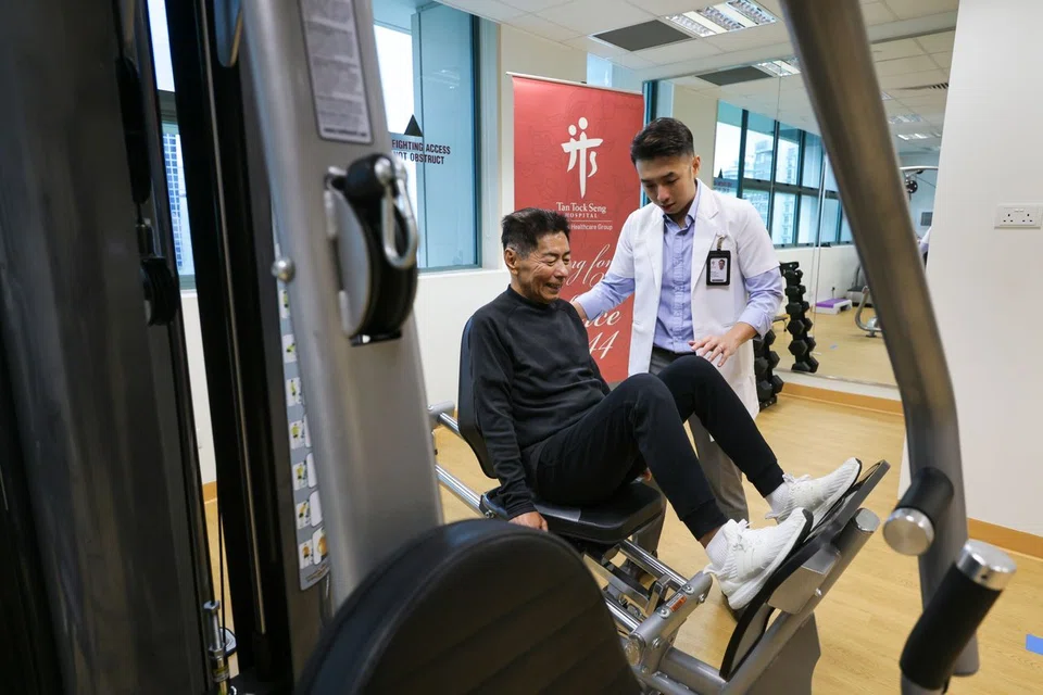 Senior physiotherapist Keith Chua and Mr Tan Kim Kiang at the Cardiac Rehab Gym in Tan Tock Seng Hospital on March 24.
