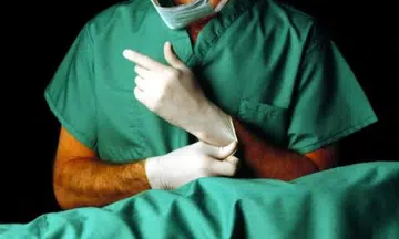 Doctor who mistakenly cut woman's arteries during kidney surgery charged with causing her death