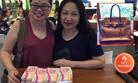 Fion (left) posing with a kind woman who donated $11k worth of vouchers but refused to take the bag. Photo: Fion's Facebook