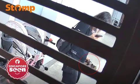 Woman takes sandals from outside Yishun flat then puts it back after spotting CCTV