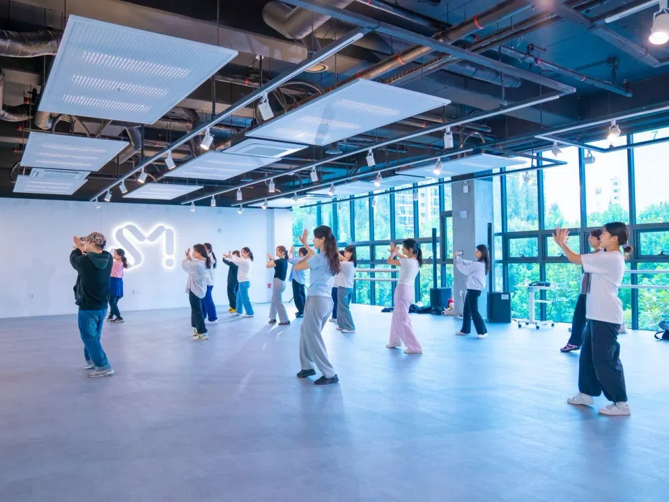 Students taking a dance lesson at the Seoul campus of SM Universe. A Singapore campus will open at *Scape come June 2025.