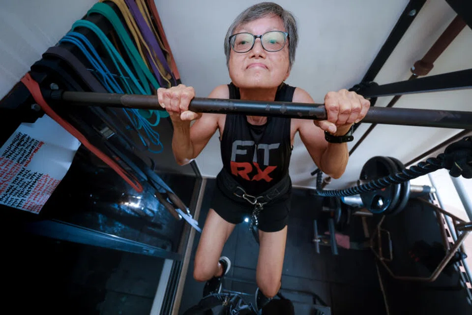 Dr Charlotte Lim doing pull-ups.